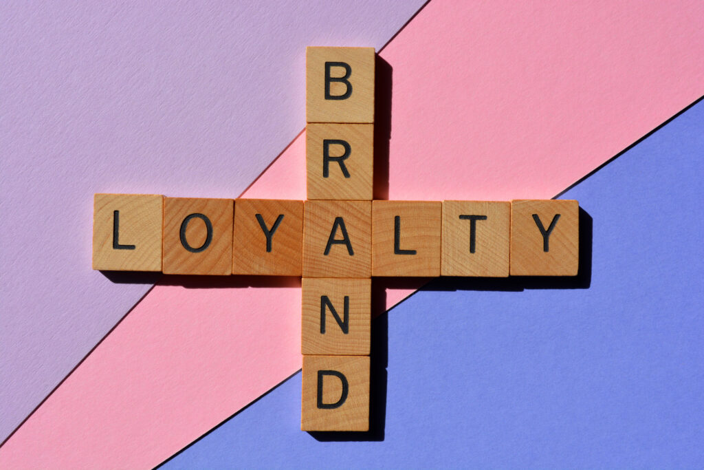Word blocks arranged to connect “brand” and “loyalty,” a simple visual for what is brand loyalty.