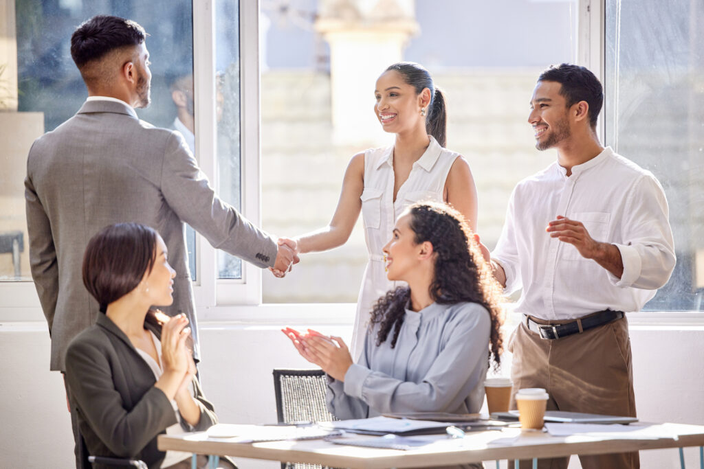 Young business professionals networking and collaborating to build a rewarding sales career.