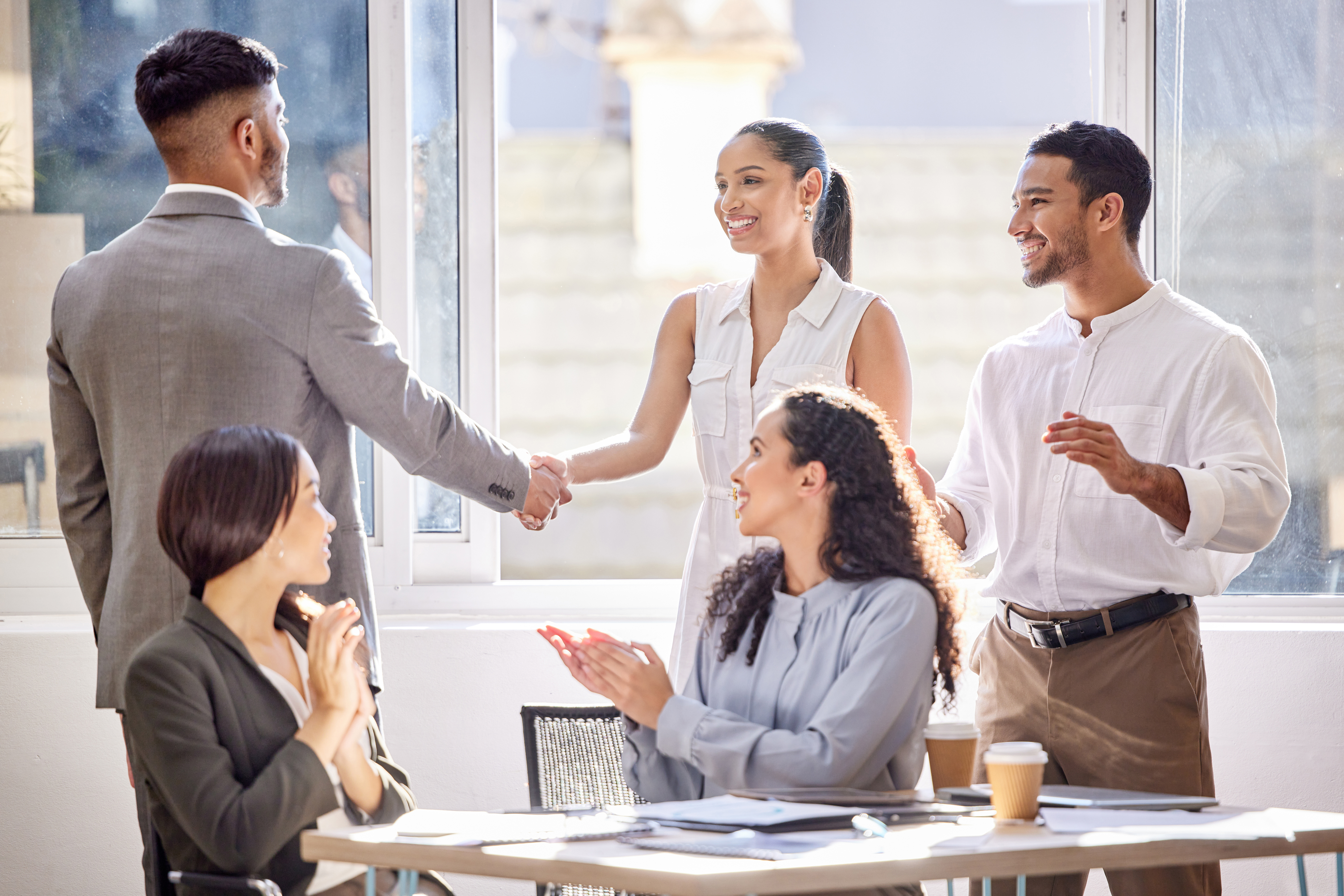 Young business professionals networking and collaborating to build a rewarding sales career.