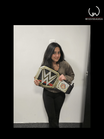 Rishita donning the championship belt in the office after high rolling challenge Friday